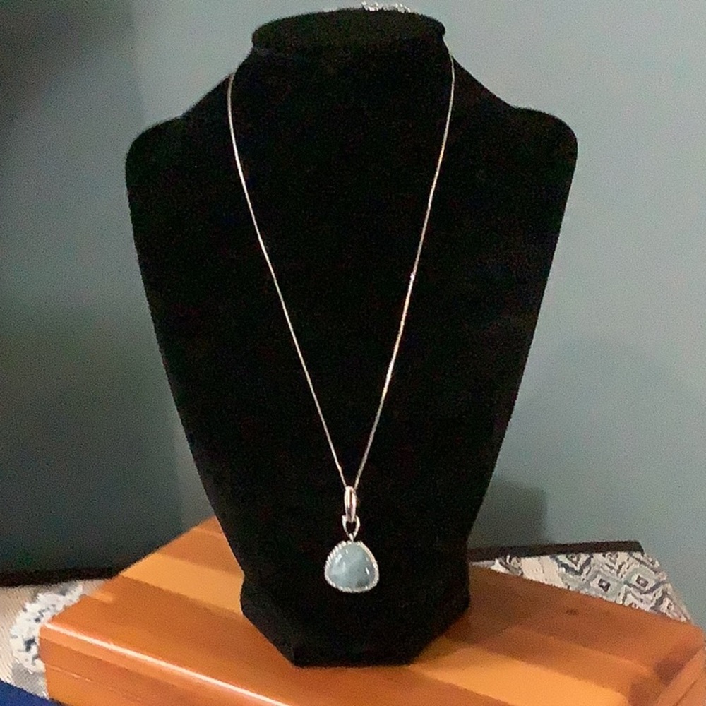 Necklace.  Aqua blue gemstone with diamond chips.